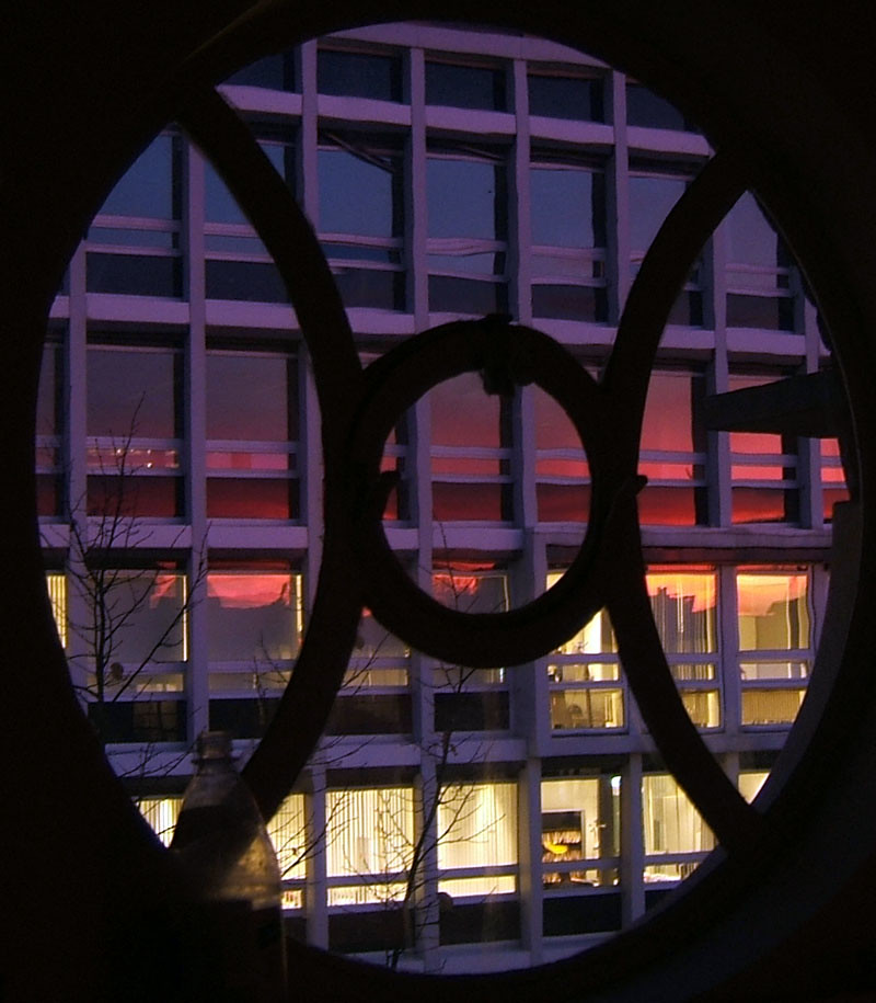 sunset reflection through round window