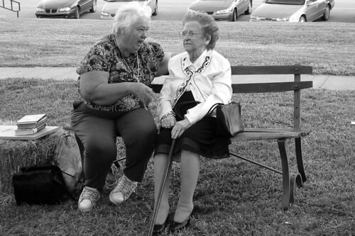 Two women talking on a bench