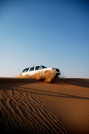 arabian desert safari sand dunes gmc truck dubai