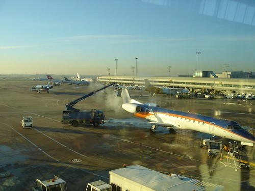 BD Embraer 145 being de-iced at MAN