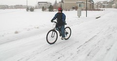 Ian rides his bike to school
