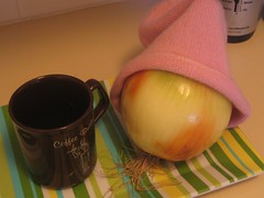 onion pulls on a hat and enjoys a cup of coffee