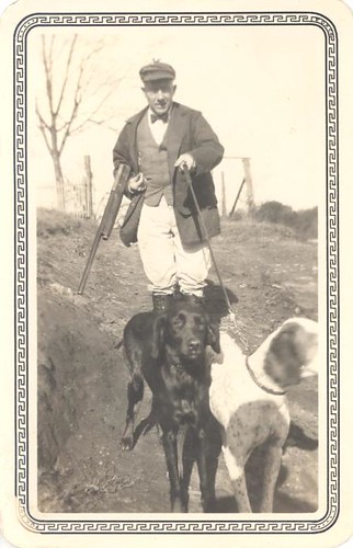 Hunter in a high fashion hunting outfit with dogs by Antique Dog Photos.