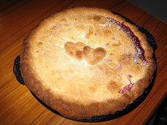 Cherry pie with two hearts on top