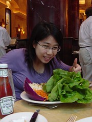 Woman enjoys salad atop The Beanstalk (a.k.a. The Cheesecake Factory). Photo by gizzypooh.