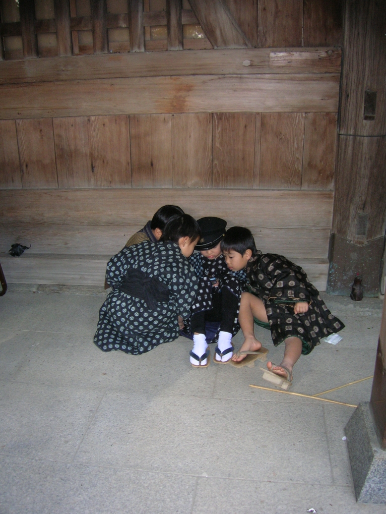 Japanese kids playing gameboy