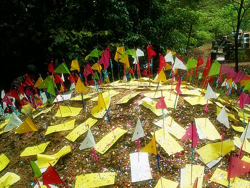 Colourful paper flags on a Chinese grave