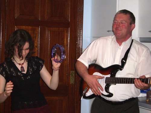My dad (who likes to play air guitar with a real guitar)