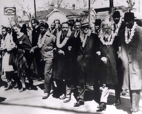 Martin Luther King on the march, accompanied by white religious representatives, including Rabbi Abraham Joshua Heschel, Alabama, 1965