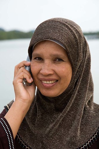  Pretty Thai Muslim woman talking on mobile phone, Phang Nga, Thailand 