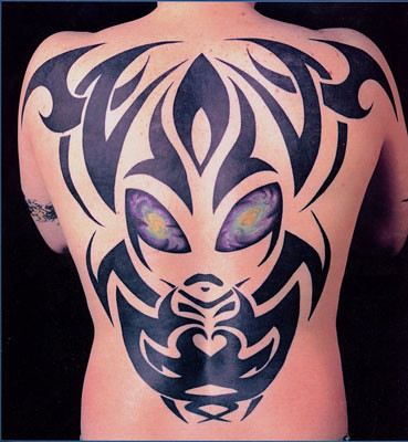 tribal side piece tattoo