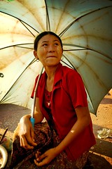 burmese woman under an umbrella