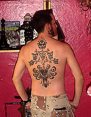 ste3ve says: Guytano has this huge awesome wallpaper tattoo - plusses for 