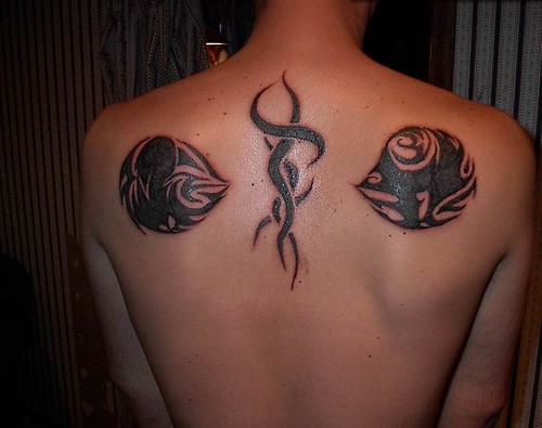pisces design tattoo tribal fish on back