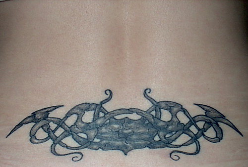lower back tattoos cover ups. Lower back cover-up piece by