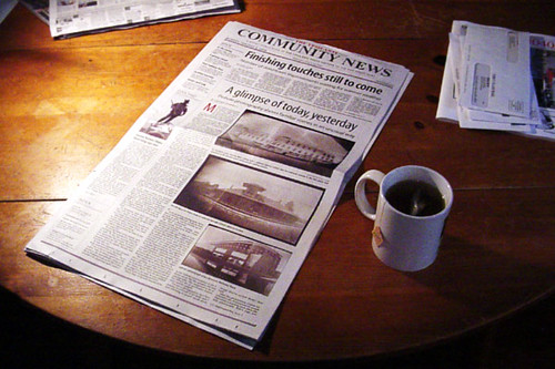 newspaper on table with mug of tea
