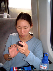 texting on the train to scotland - dscf3371 by sean dreilinger