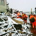 UK search & rescue team work in heavy snow in Kamaishi, Japan