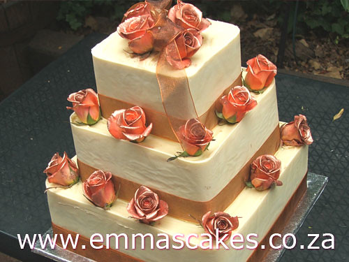 Elegant cream wedding cake with delicate pink roses Outstanding