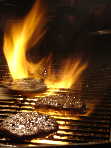 sizzling patties on a grill