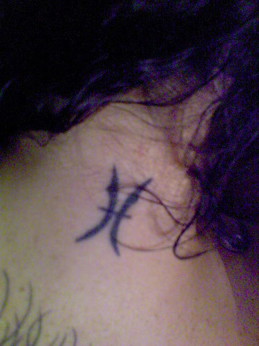 Label: pisces tattoos symbol on the neck