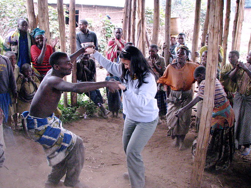 Christi joins the Batwa song and dance performance