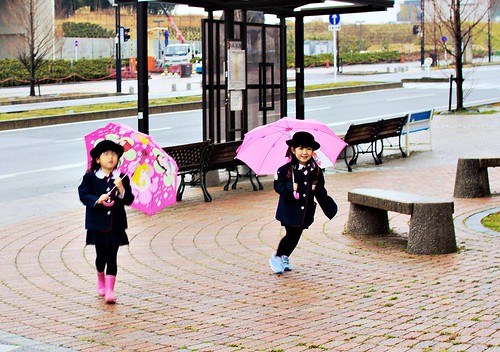 Children and umbrellas by JanneM.