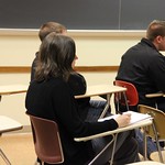 Students sitting in class during presentations.