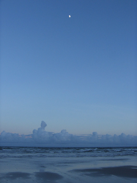 Gibbous Moon Over Blue Ocean