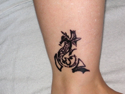 tribal panther tattoo. tribal sea horse tattoo on