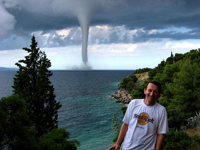 Thumb Smiling in front of a Tornado
