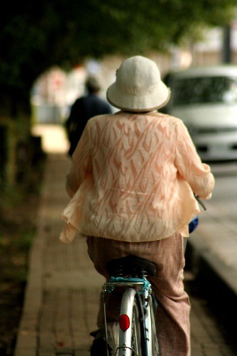 Old Lady Riding Bike