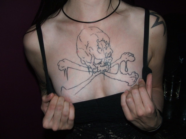 anabelle skull and crossbone tattoo. anabelle`s chest detail her fav tattoo