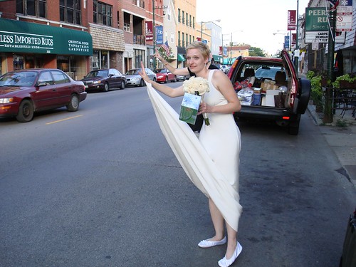 Bride hailing a taxi
