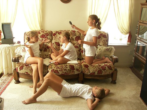 Multiplicity photograph of a girl in white clothing on a couch