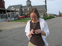 Kathryn Cramer text-messaging at the beach by Kathryn Cramer