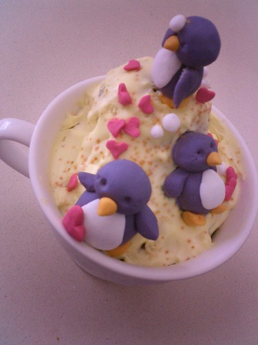 Penguins Playing in a Cup Cake