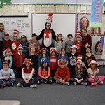 Students pose with elementary students on Dr. Seuss day