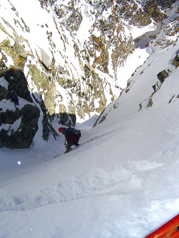 Skiing through the crux of the Southeast Couloir on the South Teton