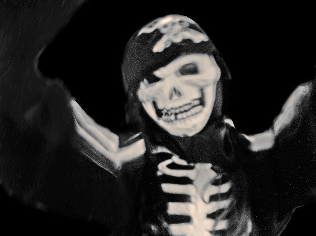 The child experiments with being a pirate skeleton