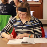 A student taking notes during the Writing Workshop.