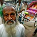 long beard and colourful rickshaw