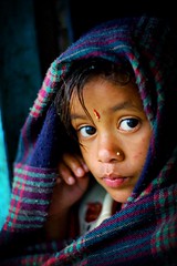 nepalese girl watching the rain