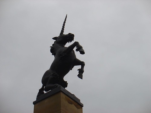 A unicorn rearing back atop the Falcon Square Mercat Cross in Inverness, Scotland.