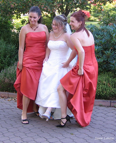 Three Sexy Ladies wearing gowns on a wedding day