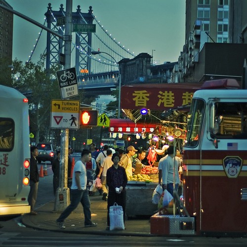 Night Market on East Broadway A lady with her bag of rice, waiting to cross. Chinatown, New York City