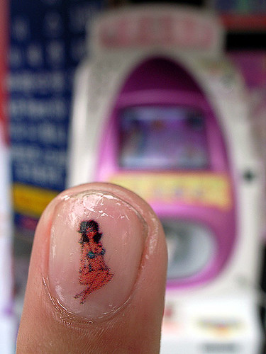 the result of Inkjet manicure with girl nail design