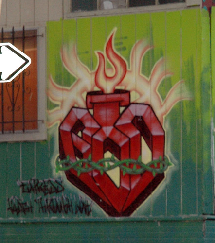 graffiti -- sacred heart: stylized heart, wrapped up and burning...
