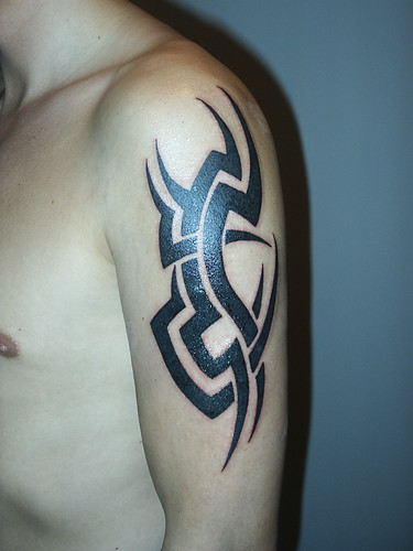 Cross Arm Sexy Tribal Tattoo Design Tattooed in the Right Arm 