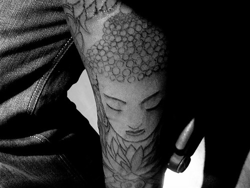 nu tattoo Buddha on fore arm